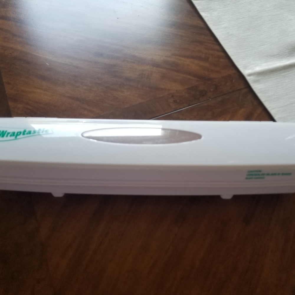 Wraptastic holder for foil or plastic
